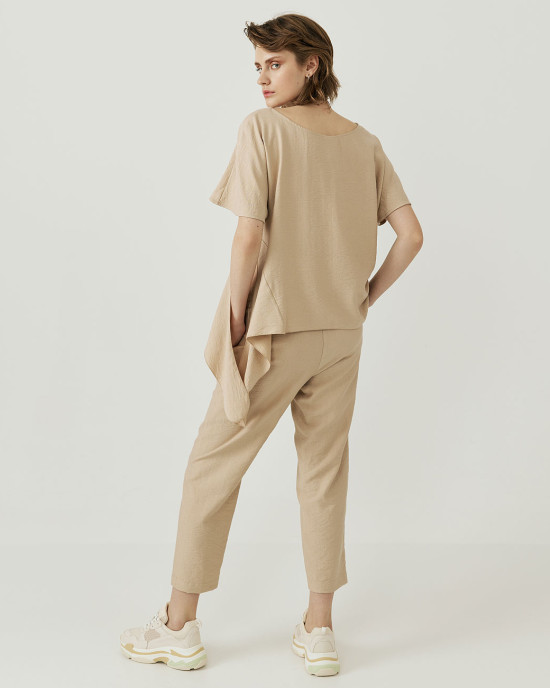 Creased blouse with asymmetry