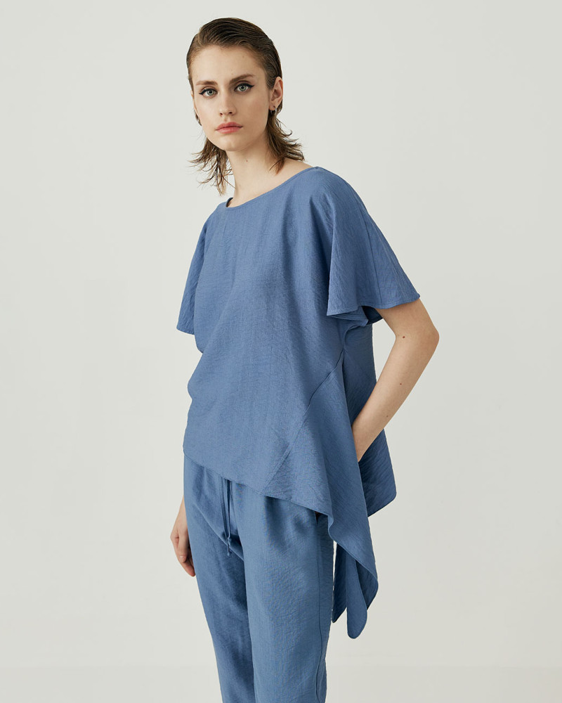 Creased blouse with asymmetry