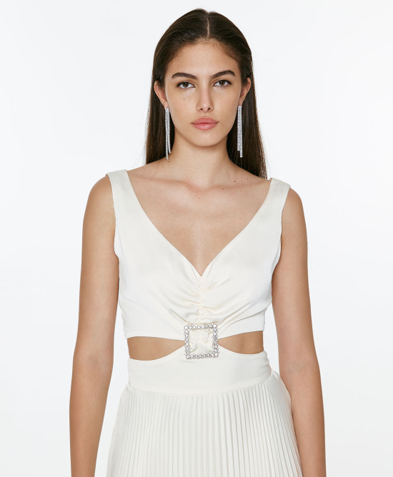 Pleated dress with waist cut-outs