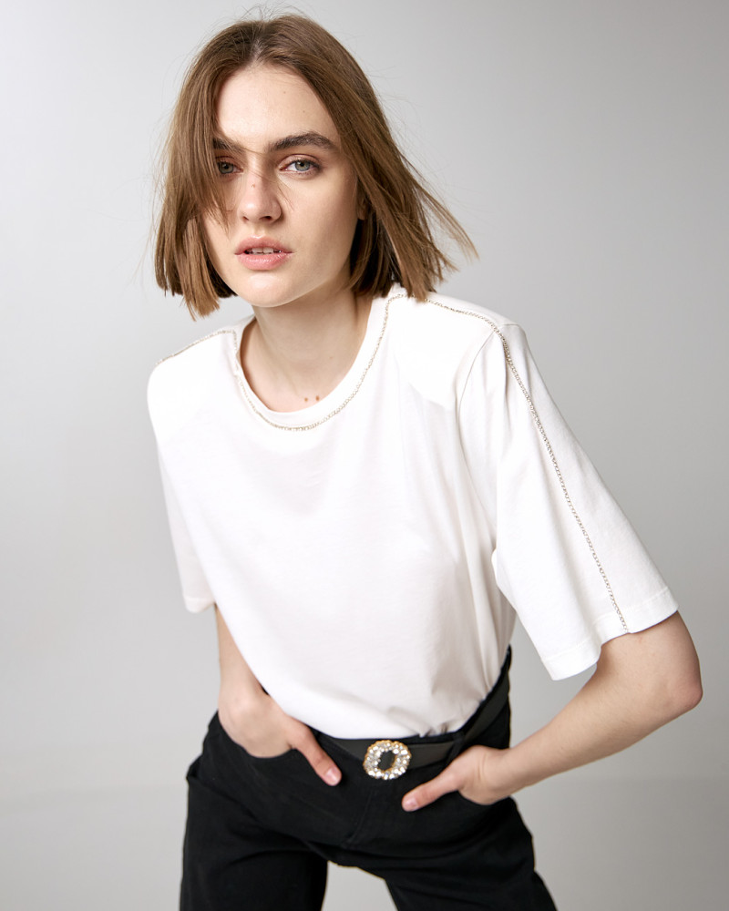 T-shirt with padded shoulders and rhinestone details