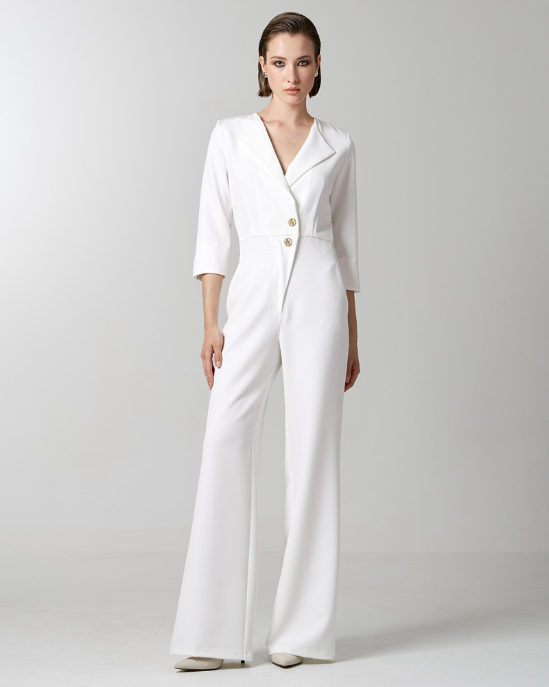 Wrap jumpsuit with monogram buttons