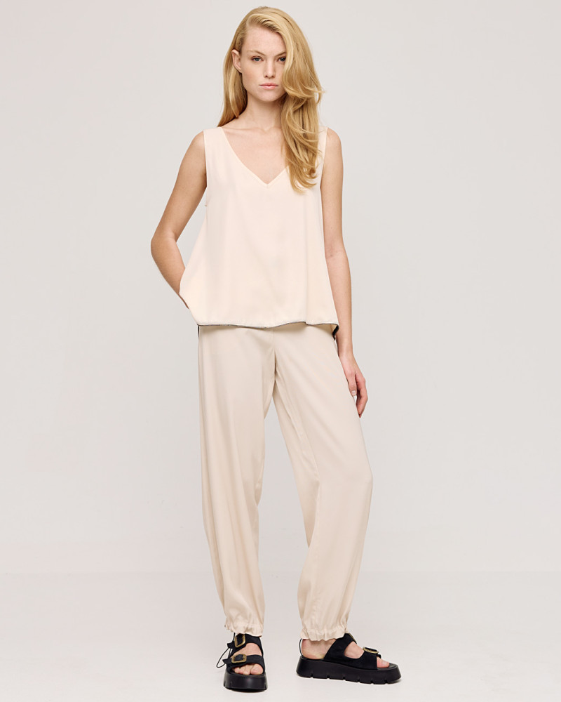 Top with straps and metallic-effect piping details