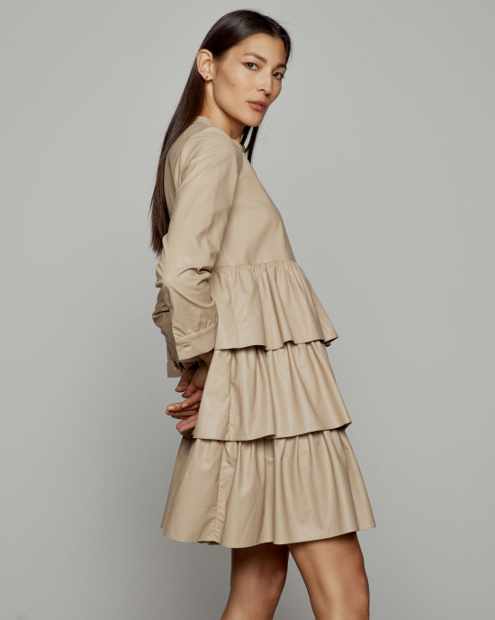 Dress in faux leather effect and ruffles