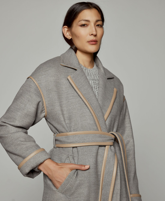 Coat with details in faux leather