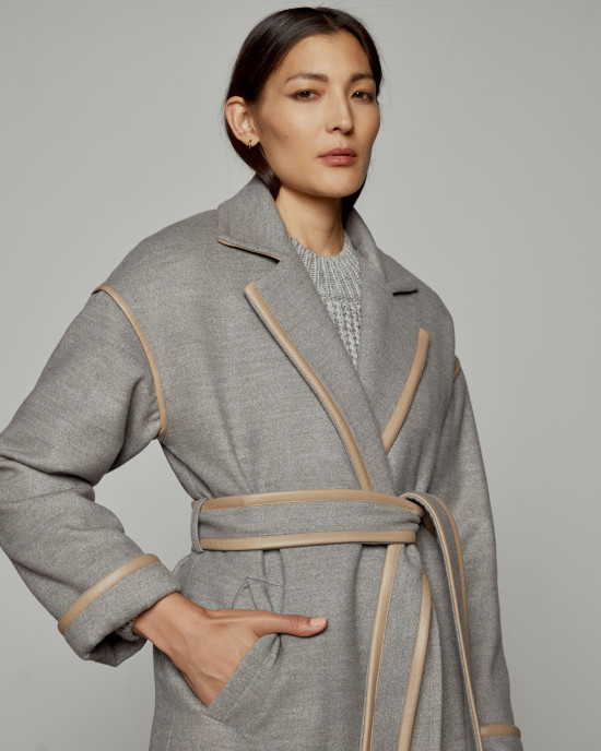 Coat with details in faux leather