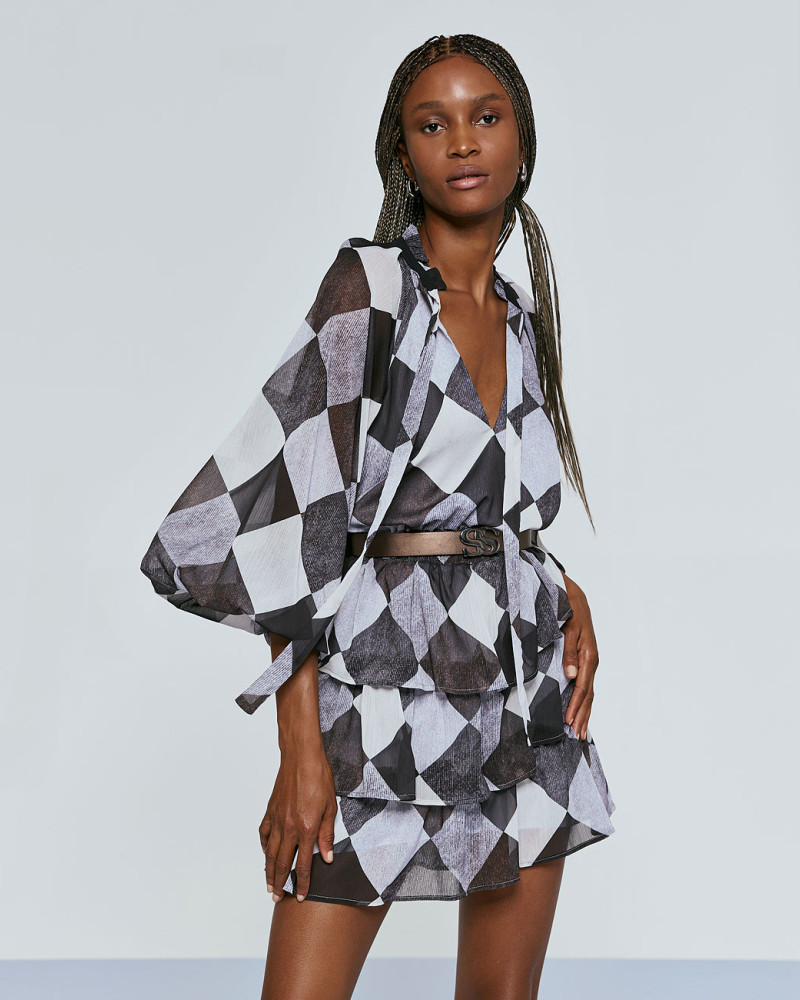 Dress in argyle pattern and with ruffles